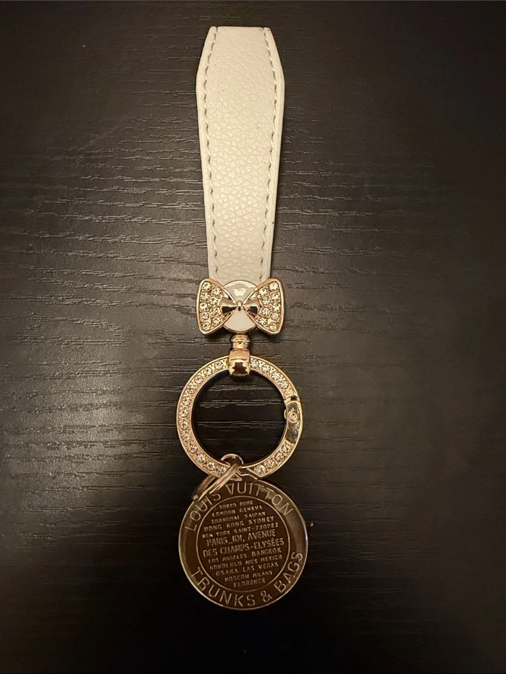 Inspired White Leather Strap Keychain with Brown Gold-Tone Medallion